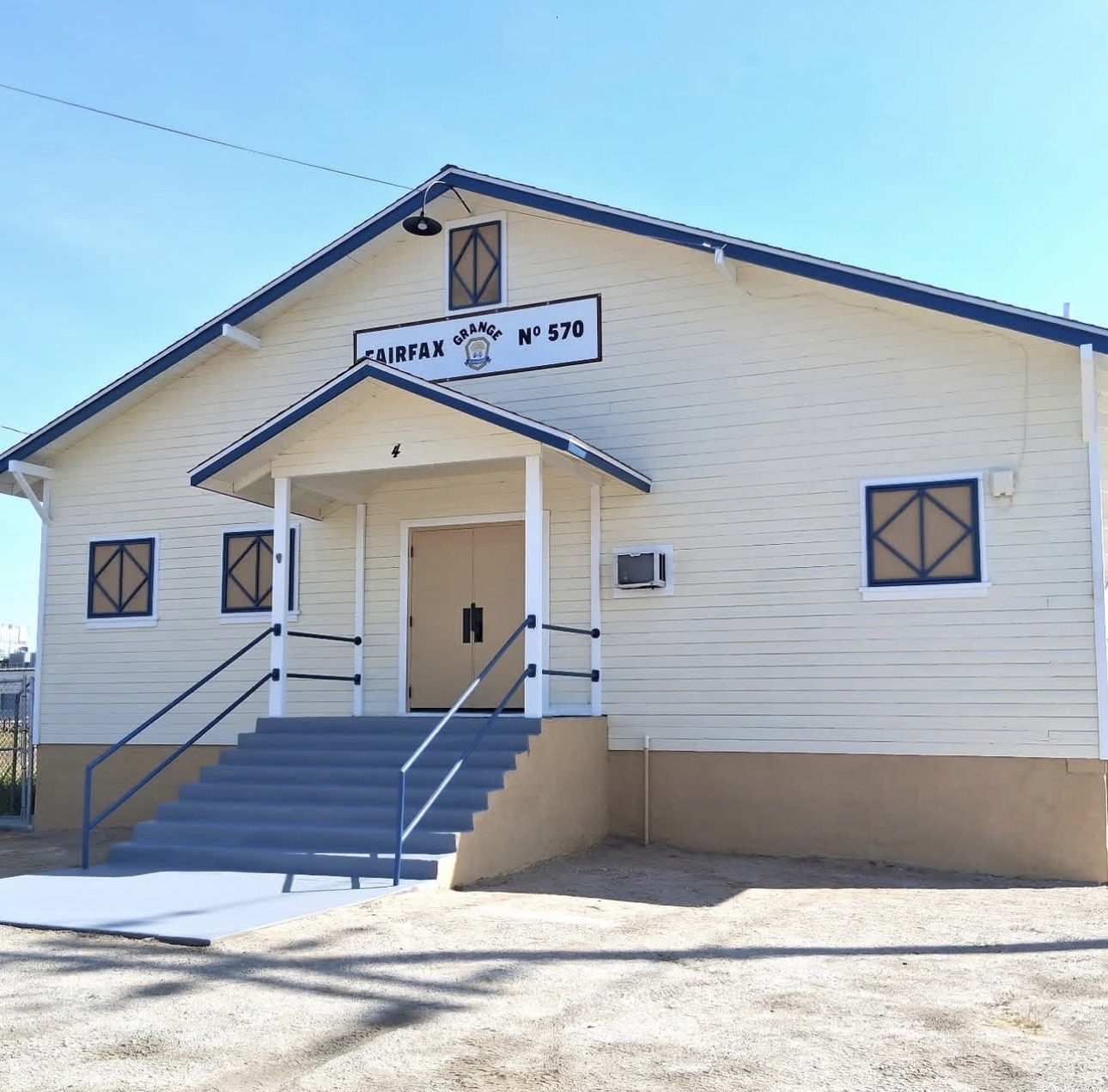 Front entrance of the freshly repainted Fairfax Grange hall, a commercial building