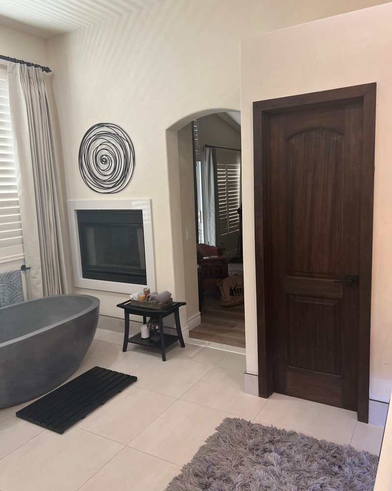 Bathroom interior with crisp white trim and stone tub